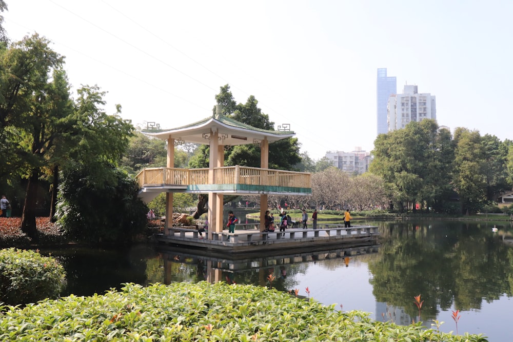 people on dock with building