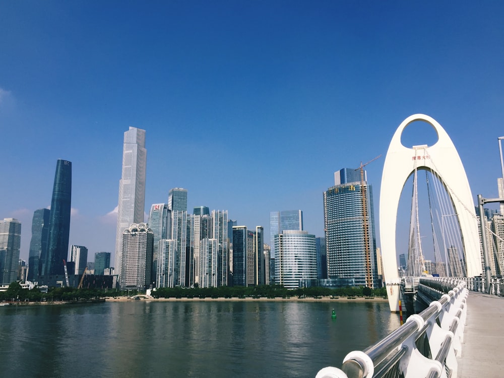 gray buildings near body of water