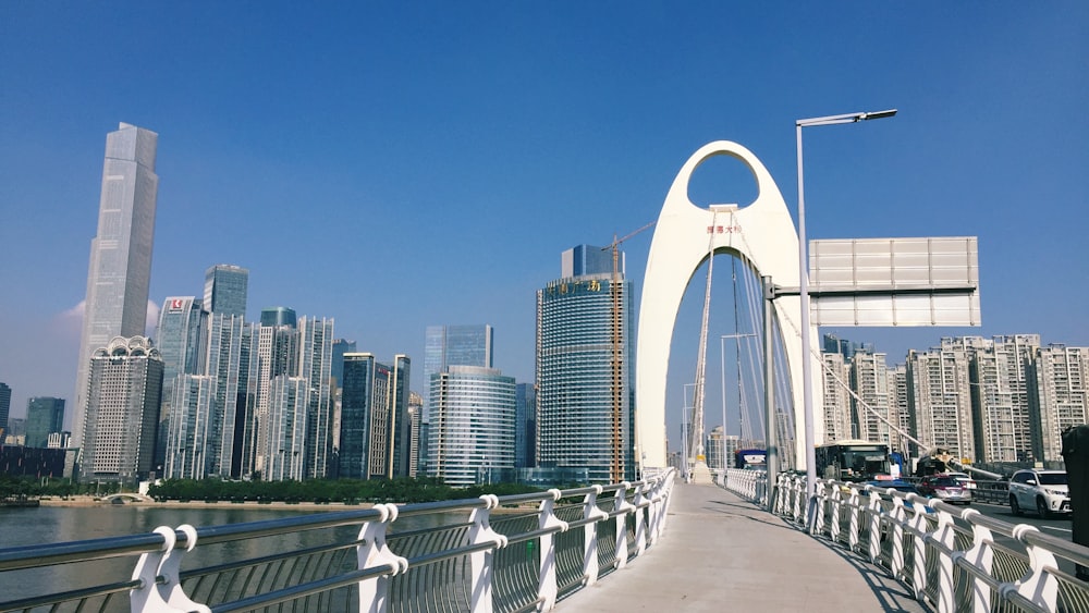 a bridge that has a very tall building in the background