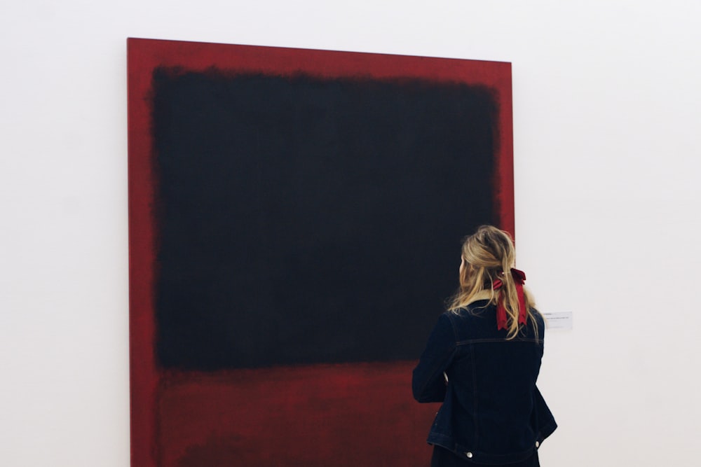 woman standing in front of blackboard