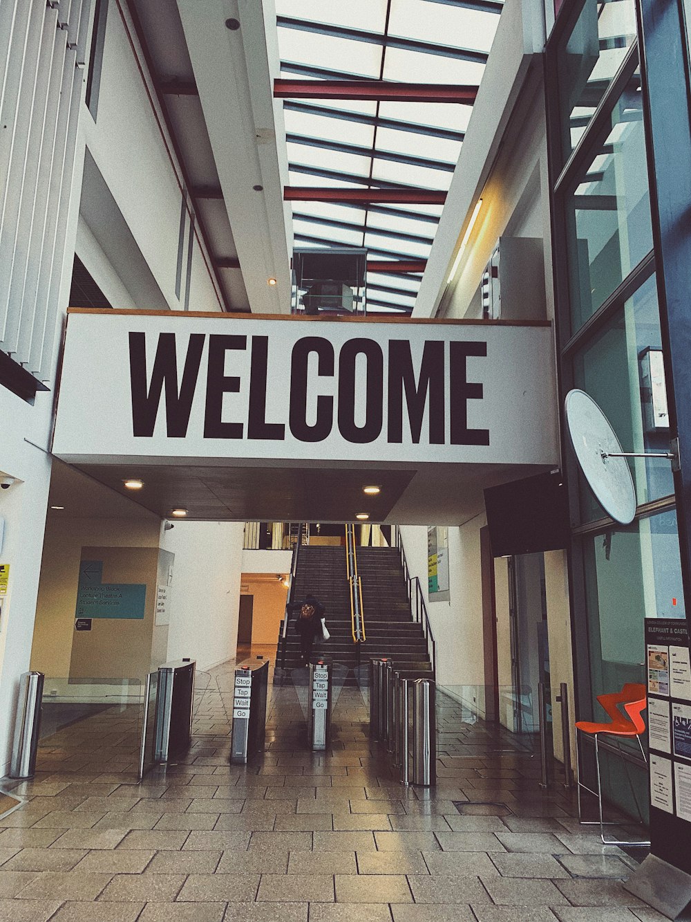 a sign that says welcome in a building