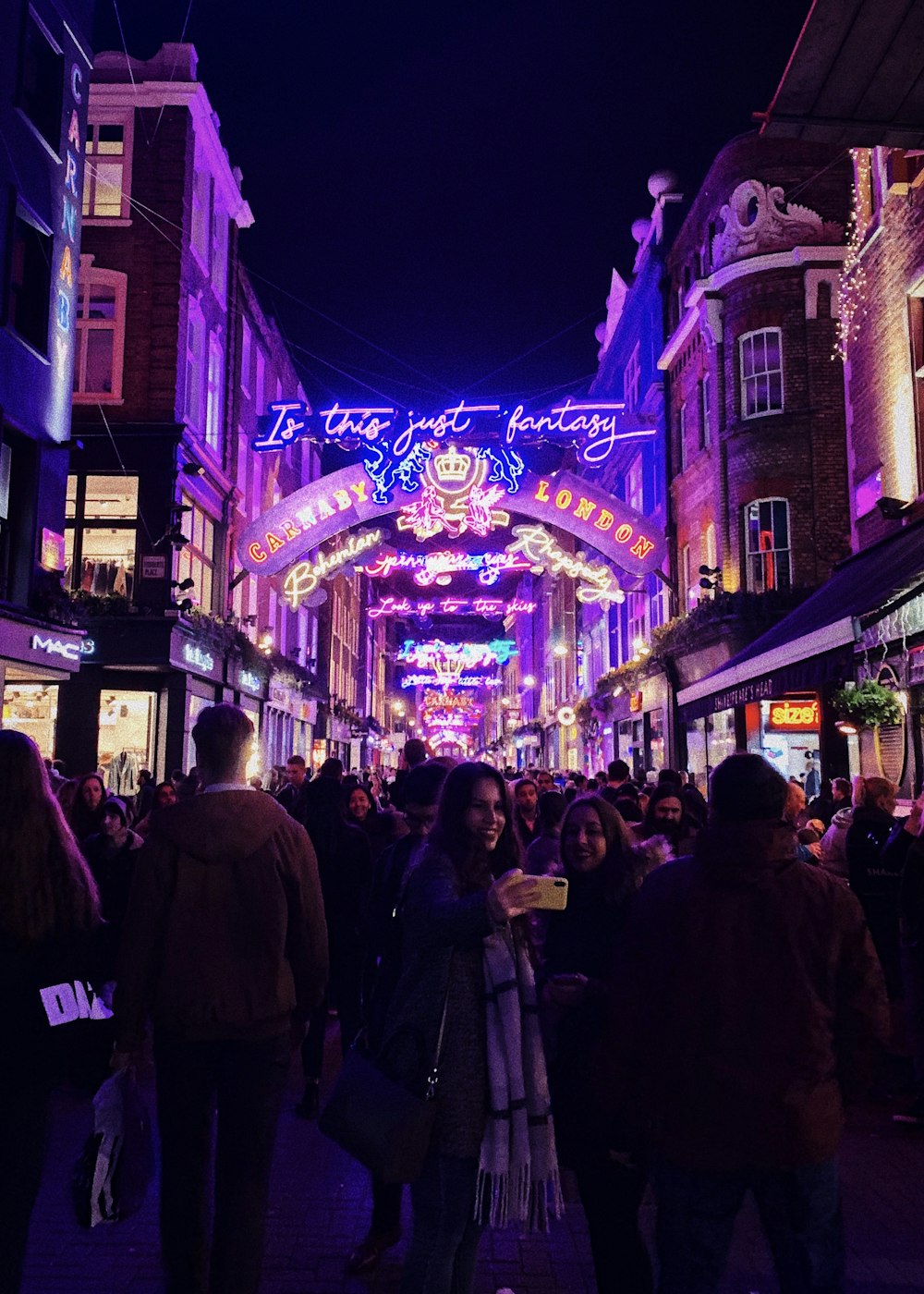 people in street at night