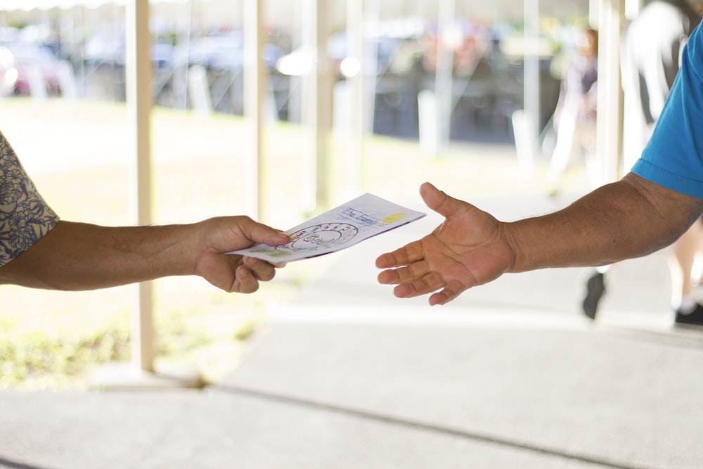 person holding card