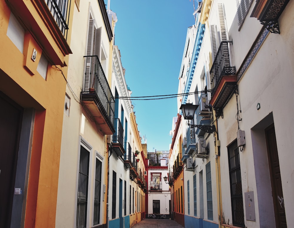 pathway between buildings at daytime