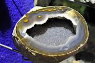 Geode-inspired tumbler featuring deep blues and sparkling crystal details.