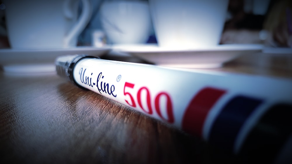 a close up of a tube of toothpaste on a table