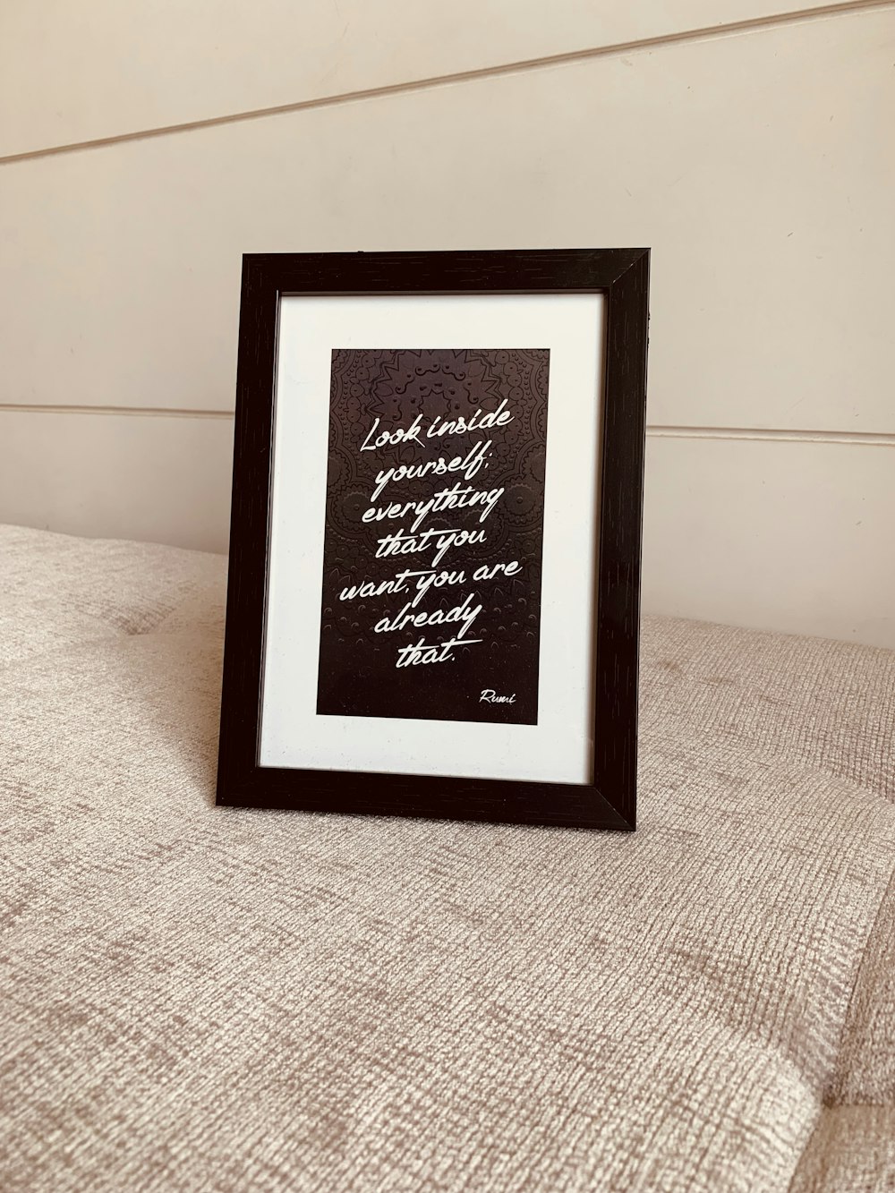 white and black photo frame with quote