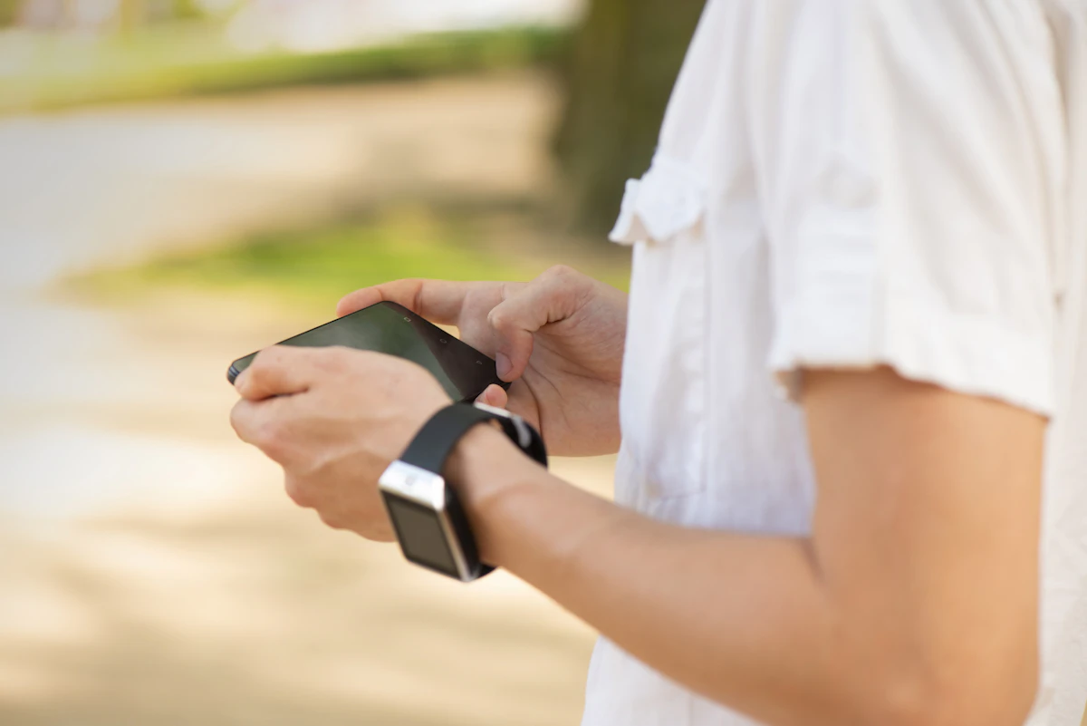 closeup photo of person holding smartphone