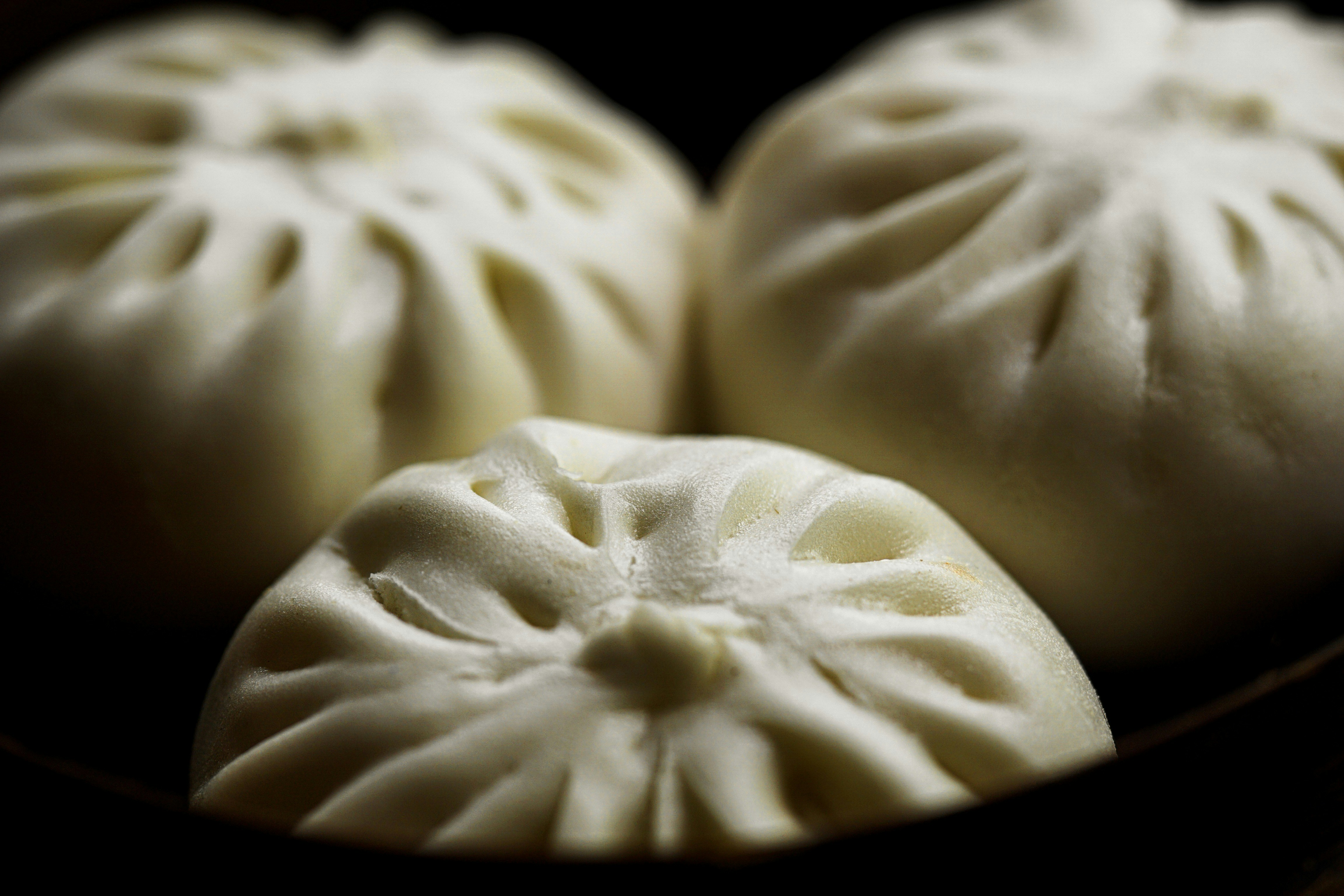 three steam buns dumpling teams background