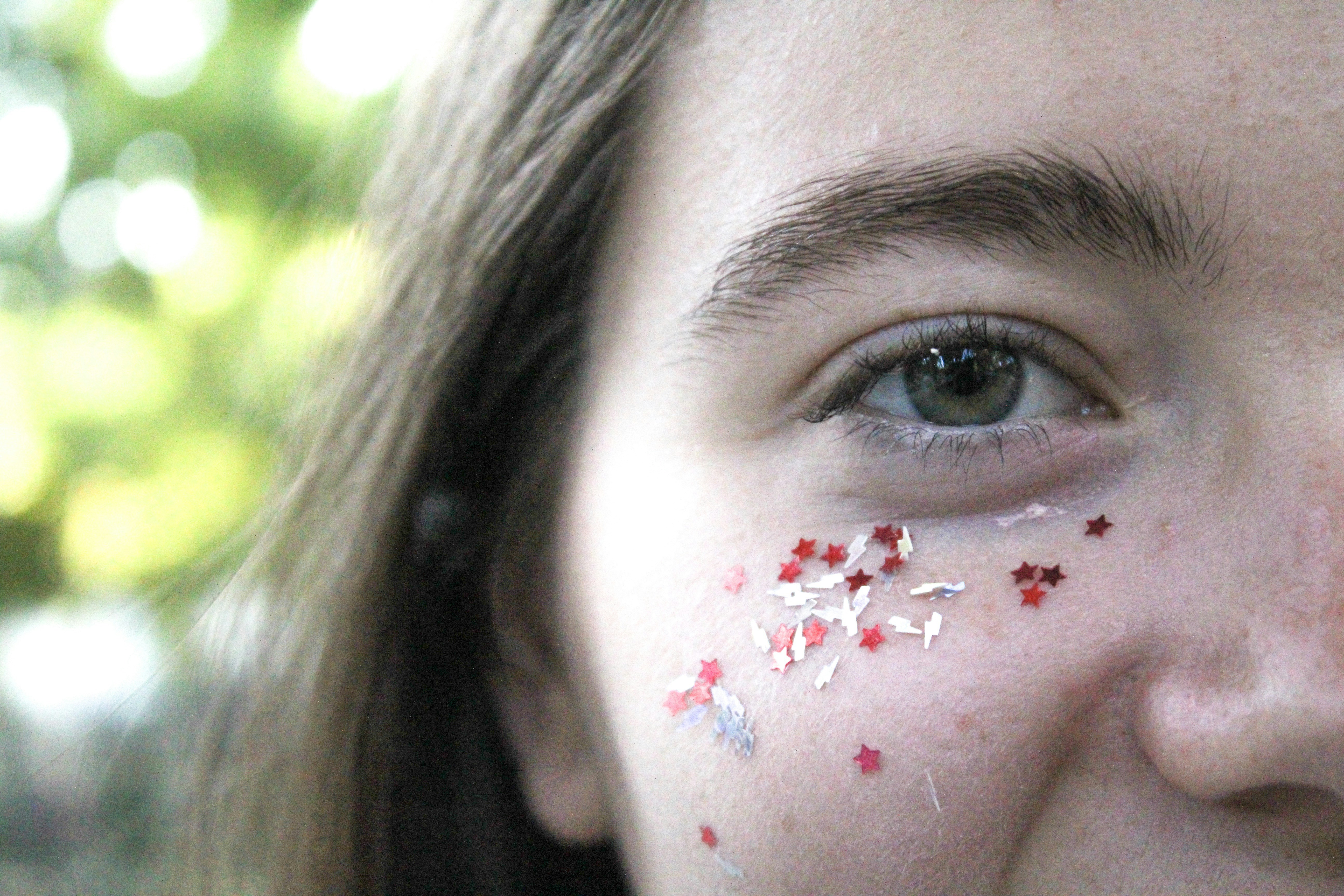 Close-up of a student with visible injuries on their face, looking distressed and vulnerable.