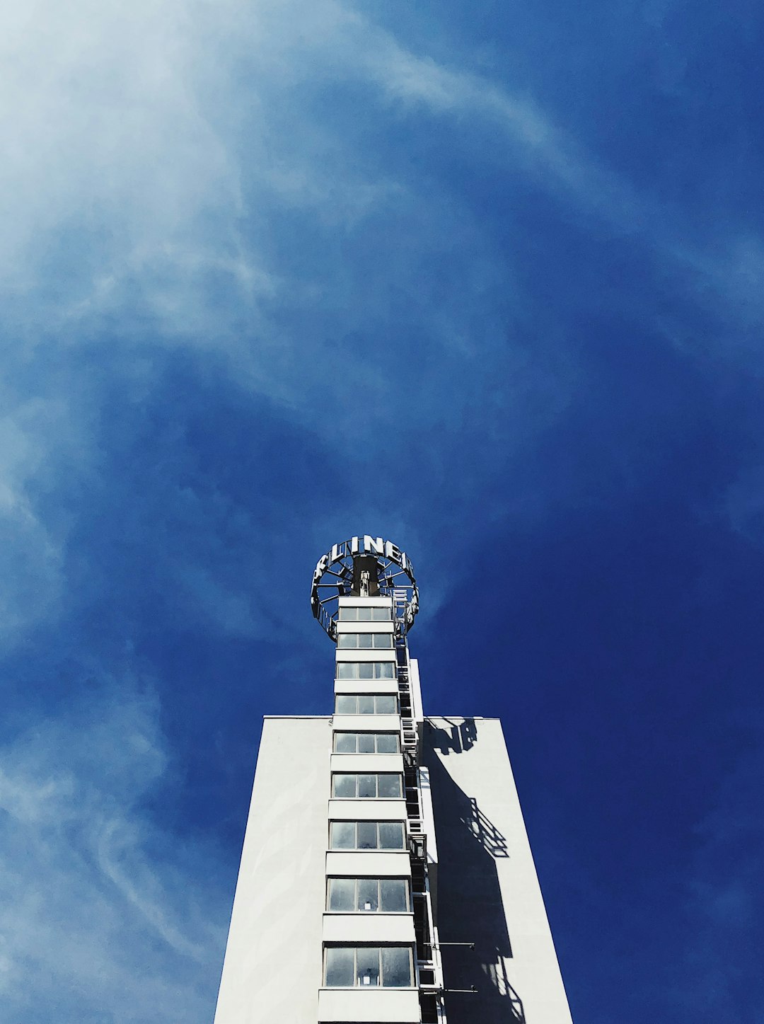 gray concrete building under clear blue sky