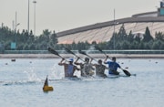 four men paddling kayak