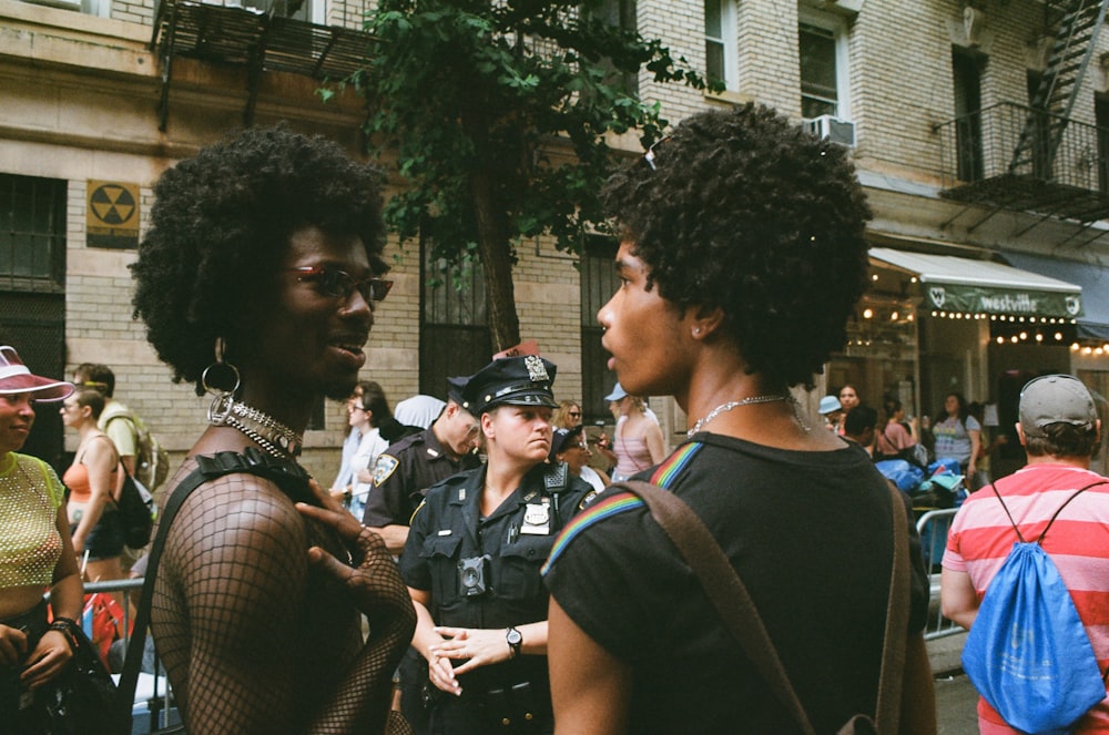 two persons talking to each others at the street