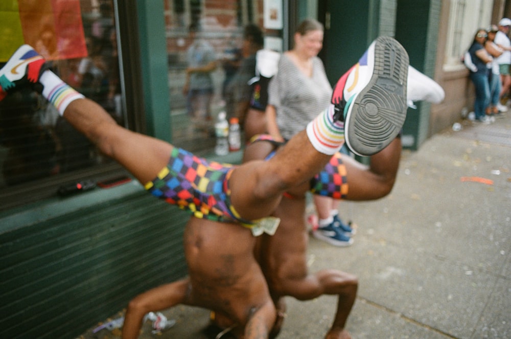 shallow focus photo of topless man head standing