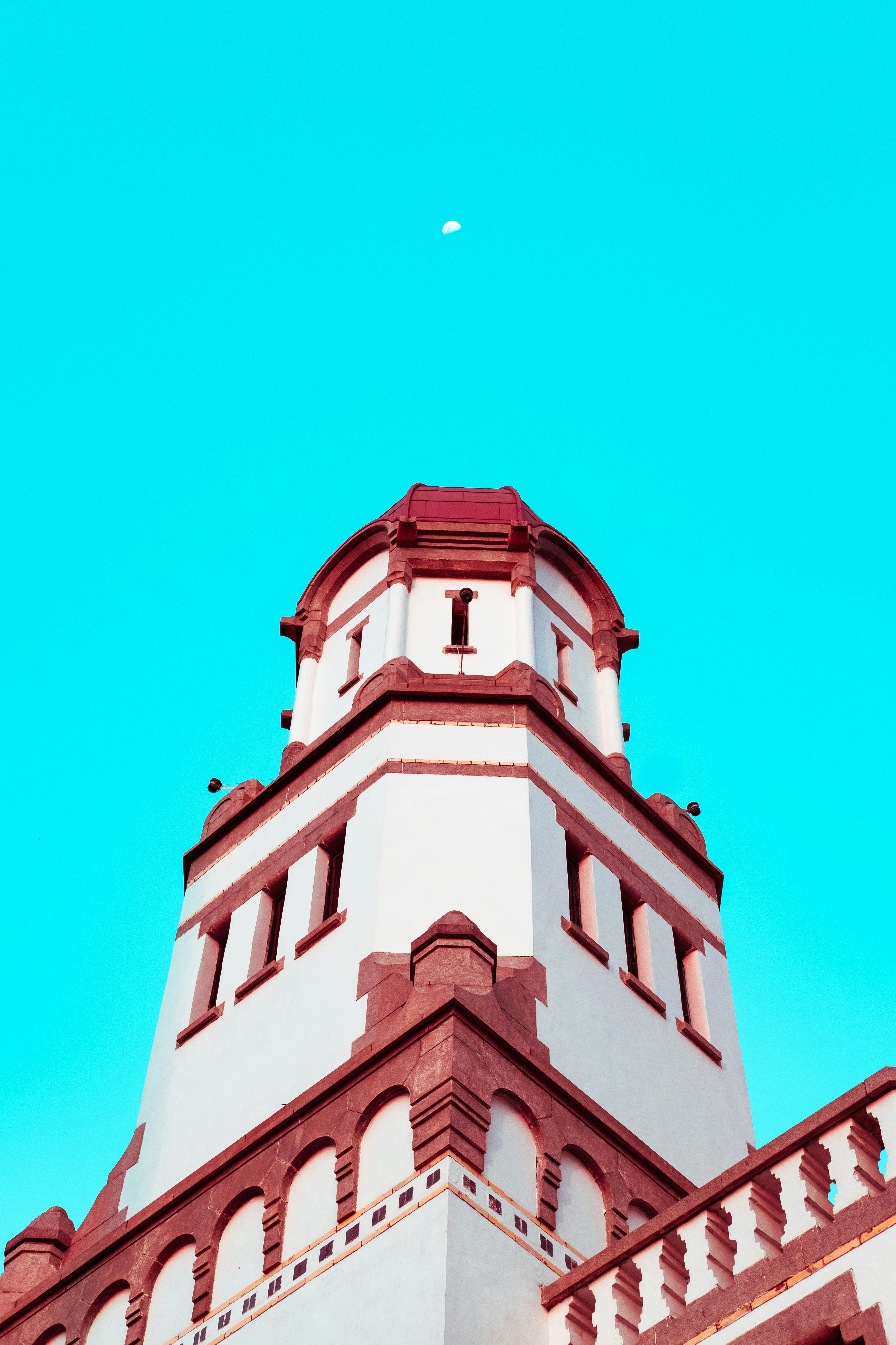 low-angle photography of red and white building