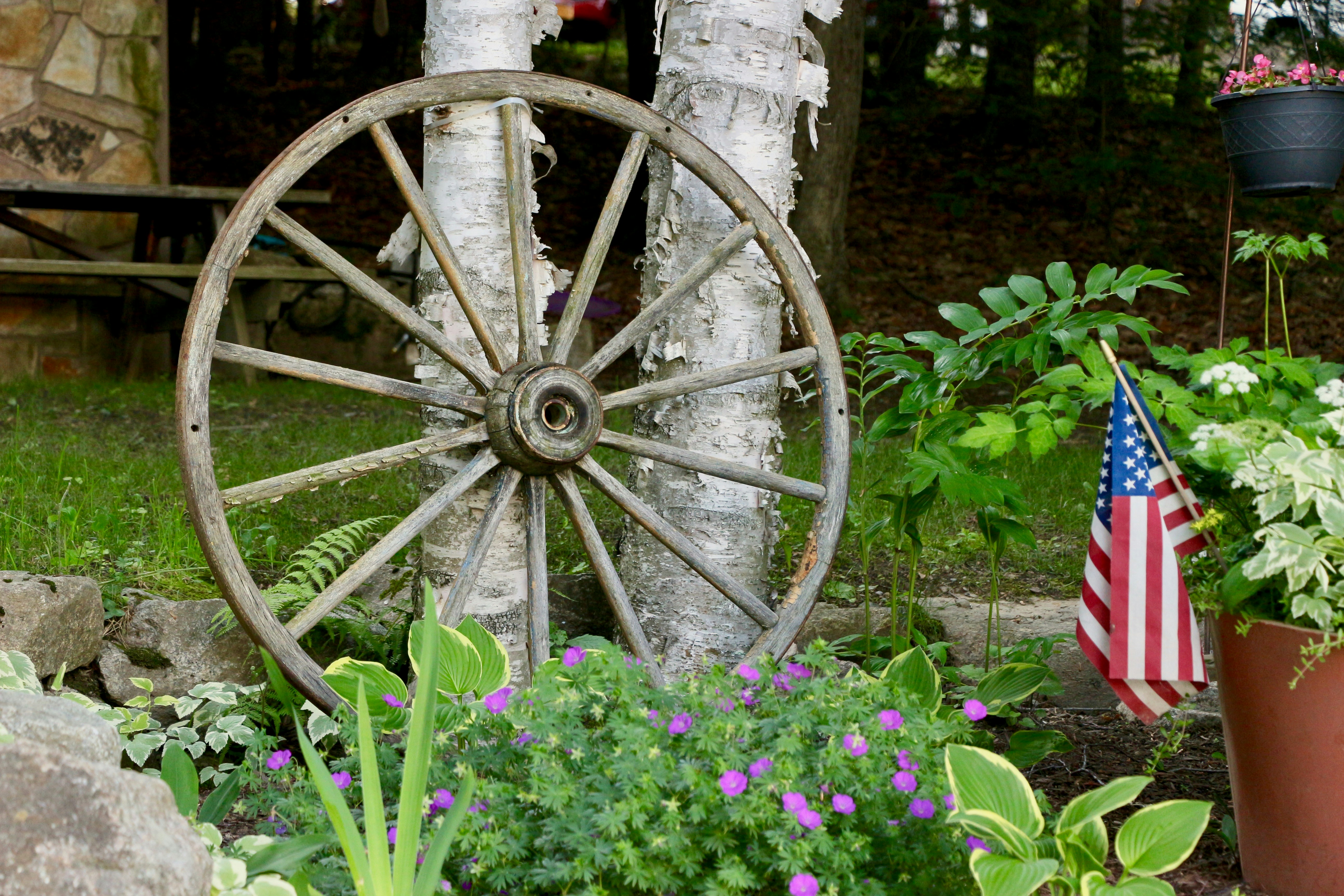 flag of America near wheel outdoor during daytime