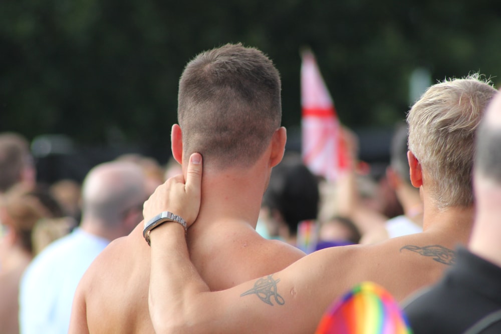 man holding another man's neck