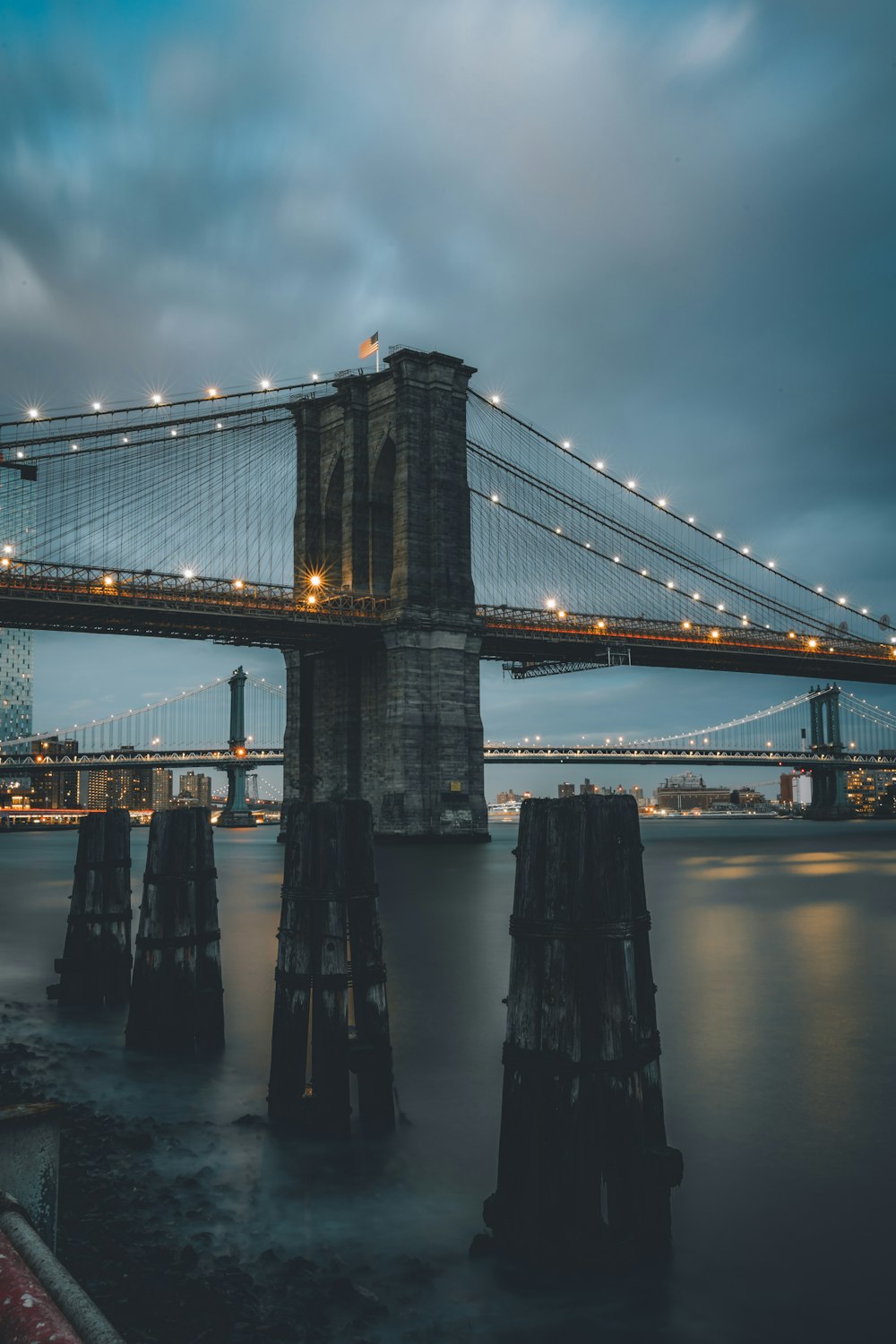 Brooklyn bridge under cloudy sky