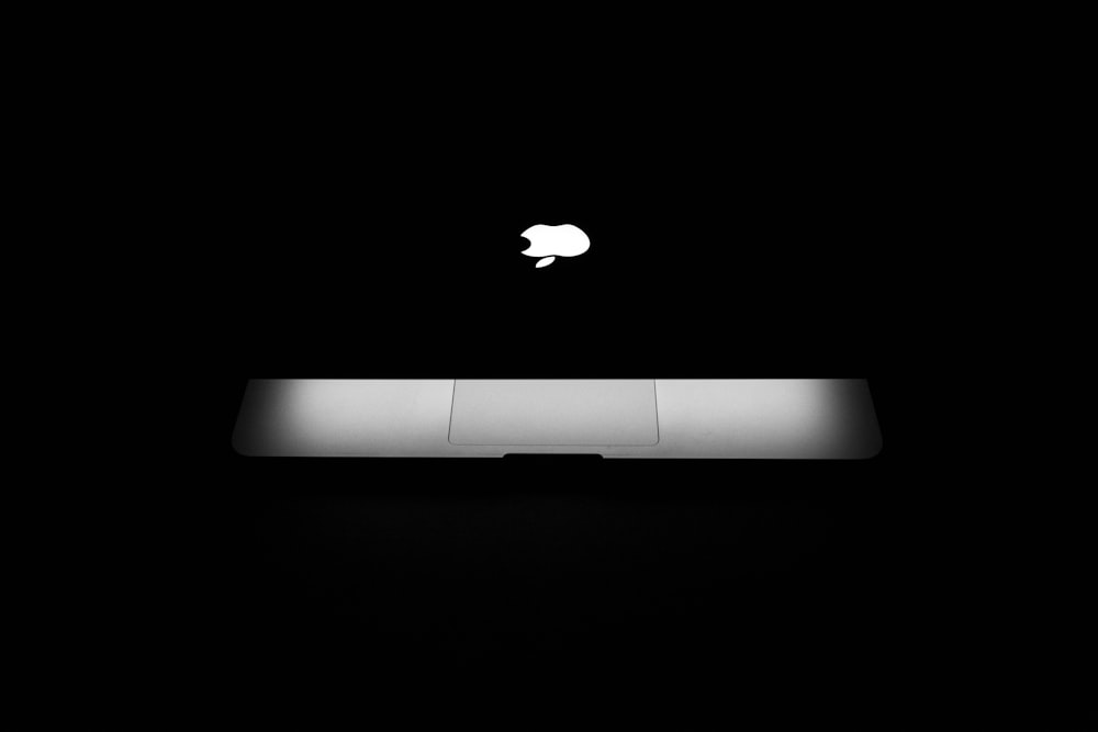 a black and white photo of an apple computer