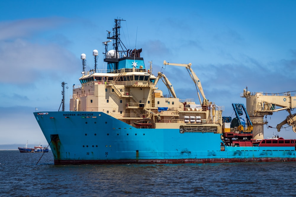 blue and white cargo ship