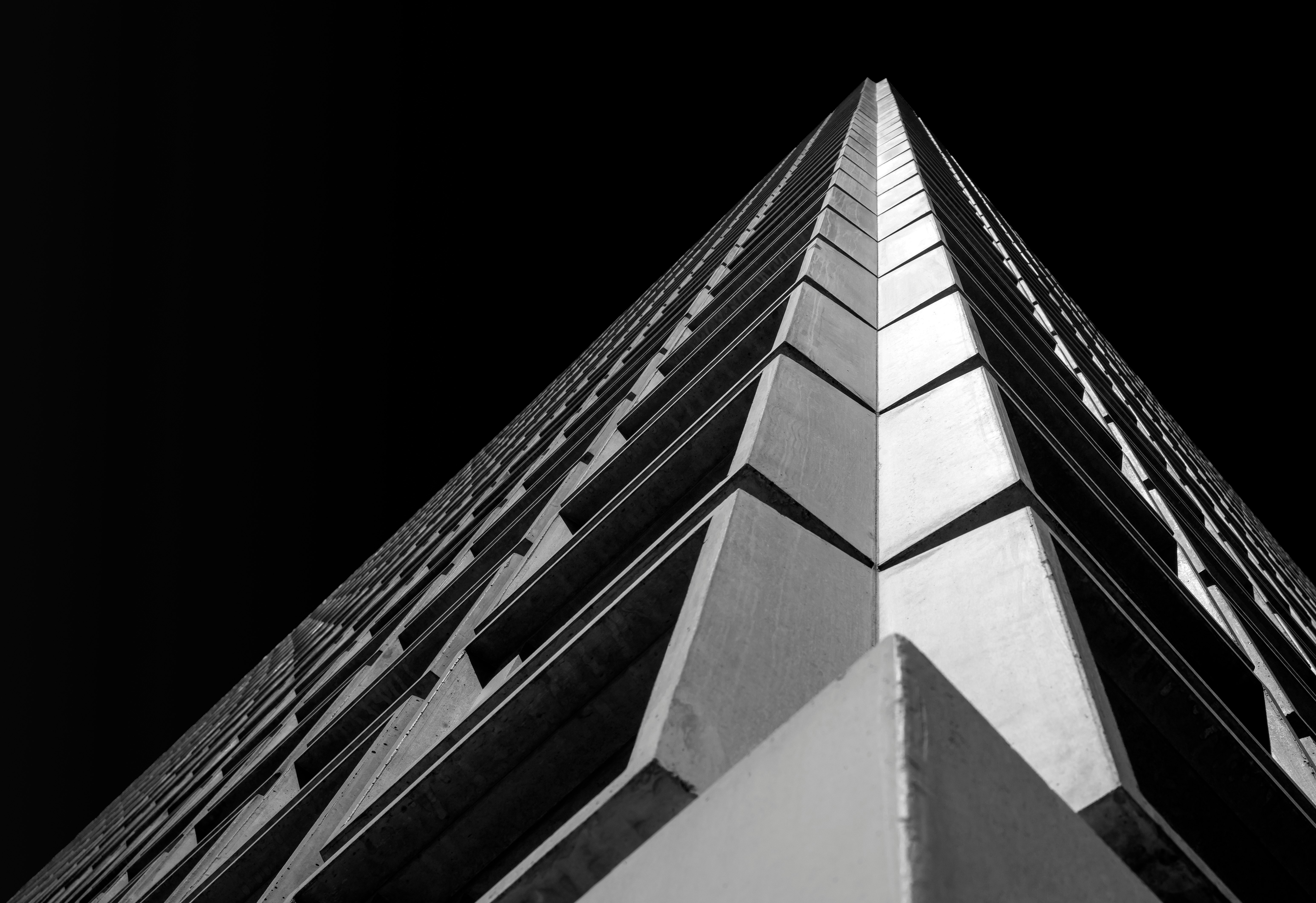low-angle photo of white and black building