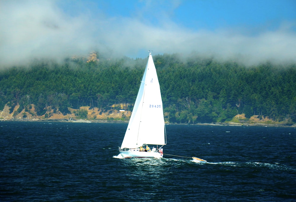 boat sailing on ocean during daytime