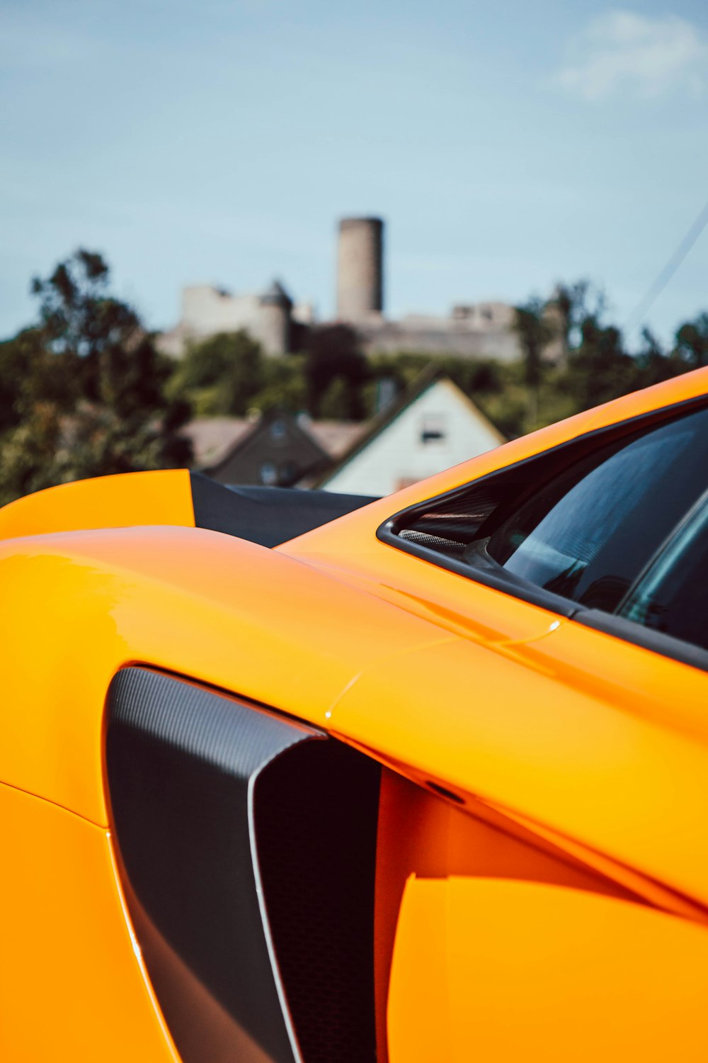 selective focus photo of yellow and gray vehicle