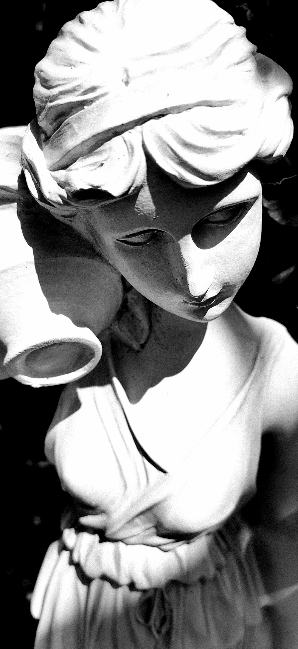 woman with vase statue