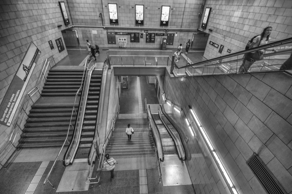 greyscale photography of stair inside building