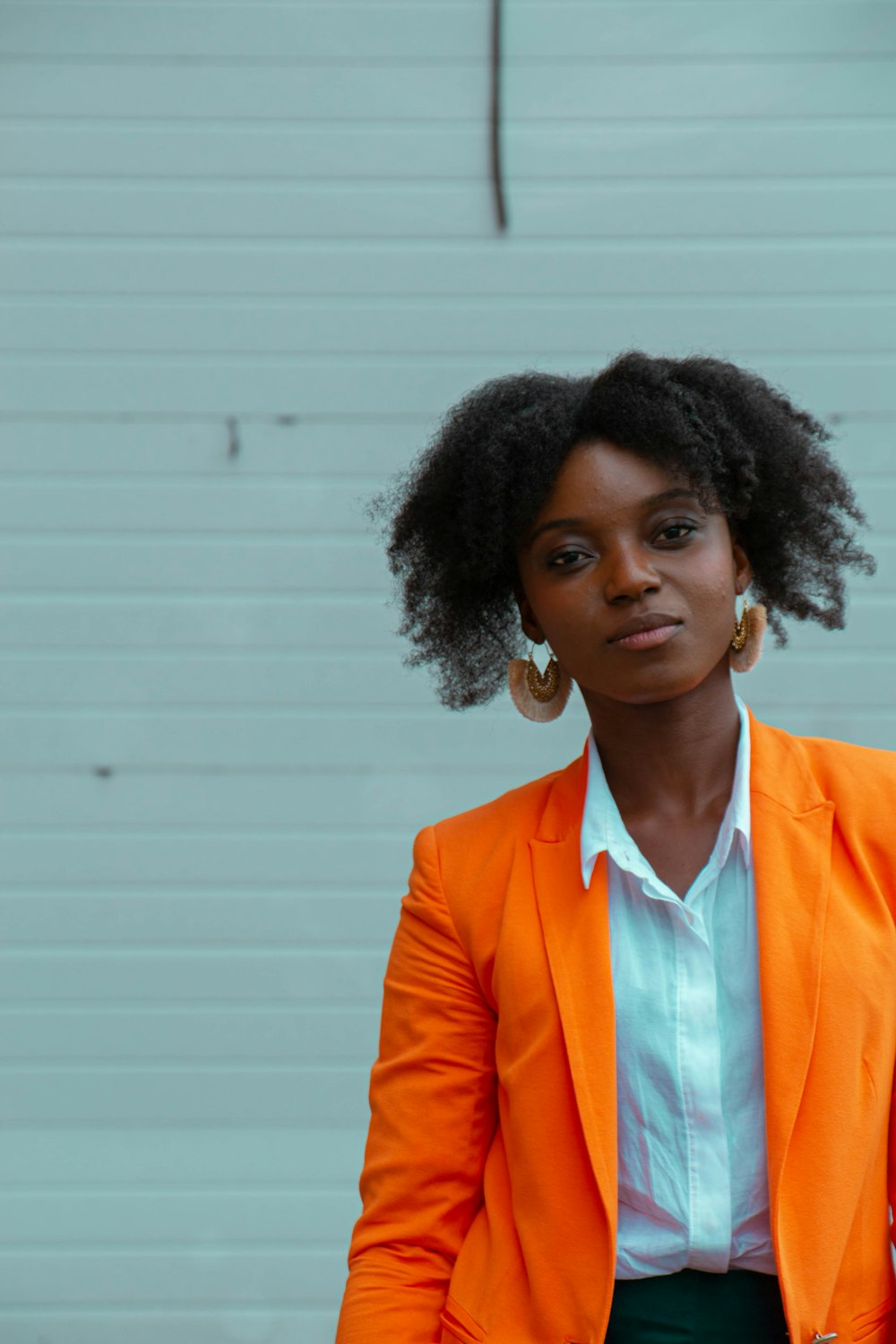 woman standing near white wall