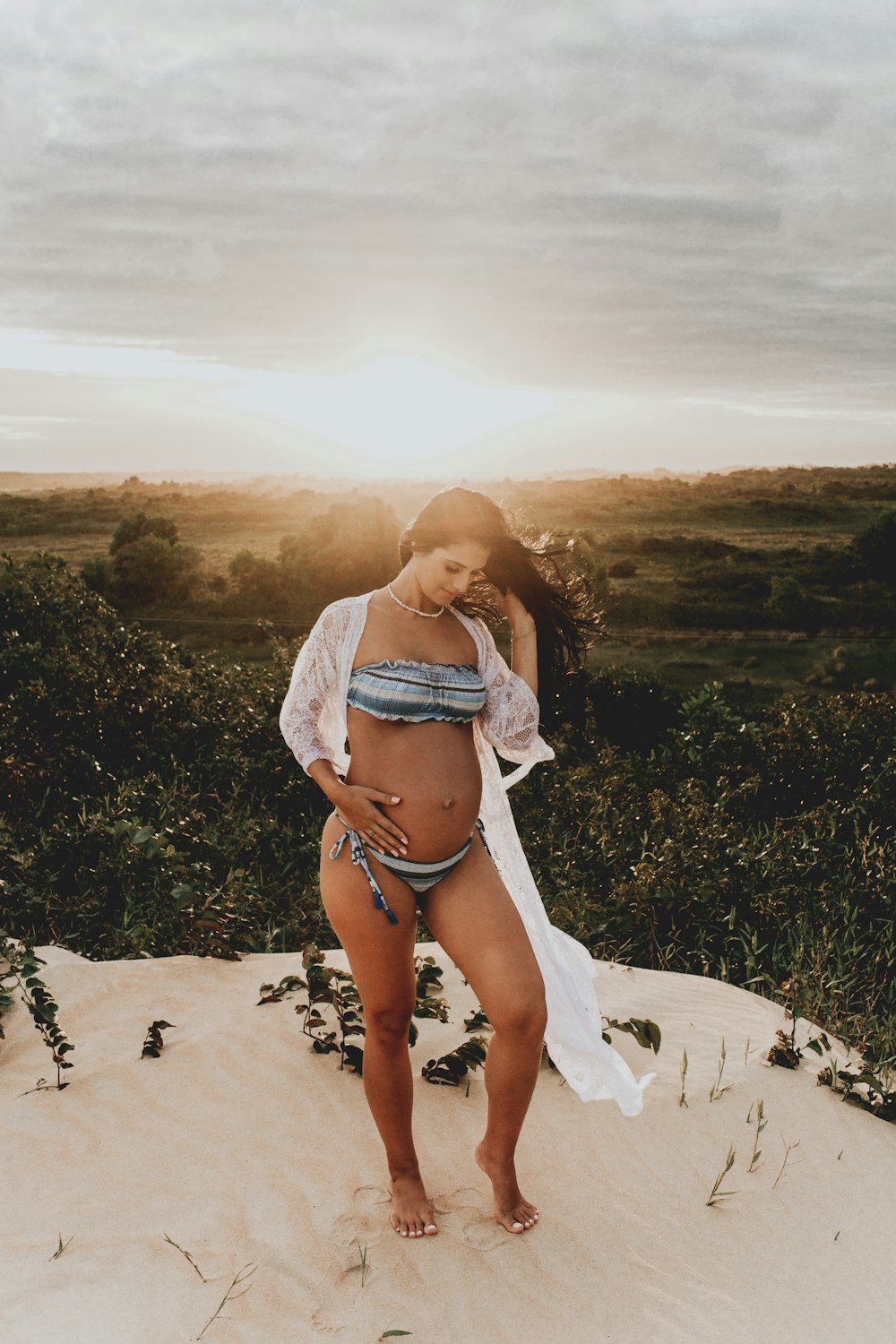 woman wearing blue and white striped bikini