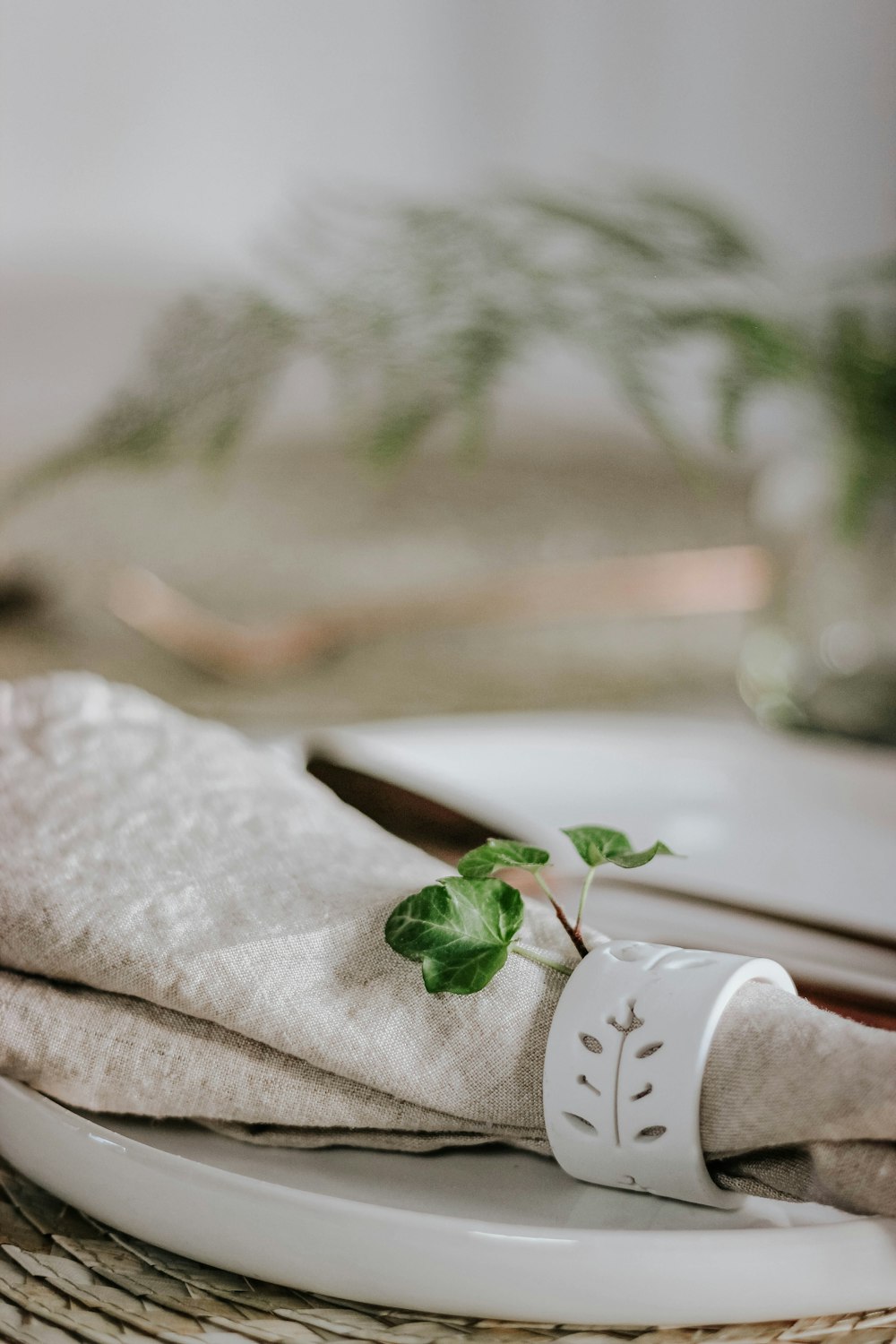 selective focus photo of white table napkin cloth on white table