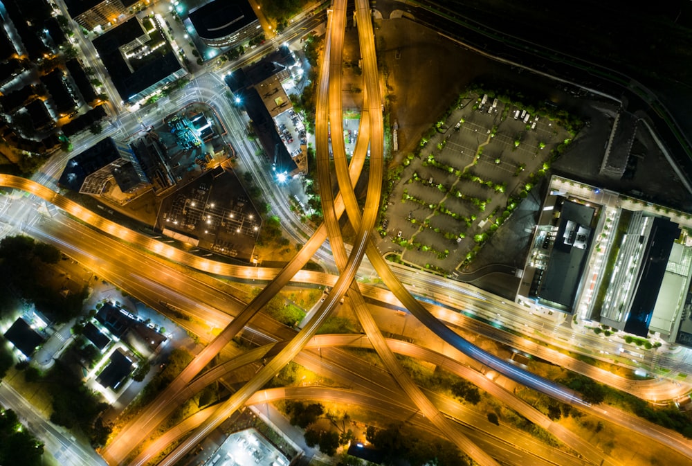 aerial photo of moving vehicles on road at night