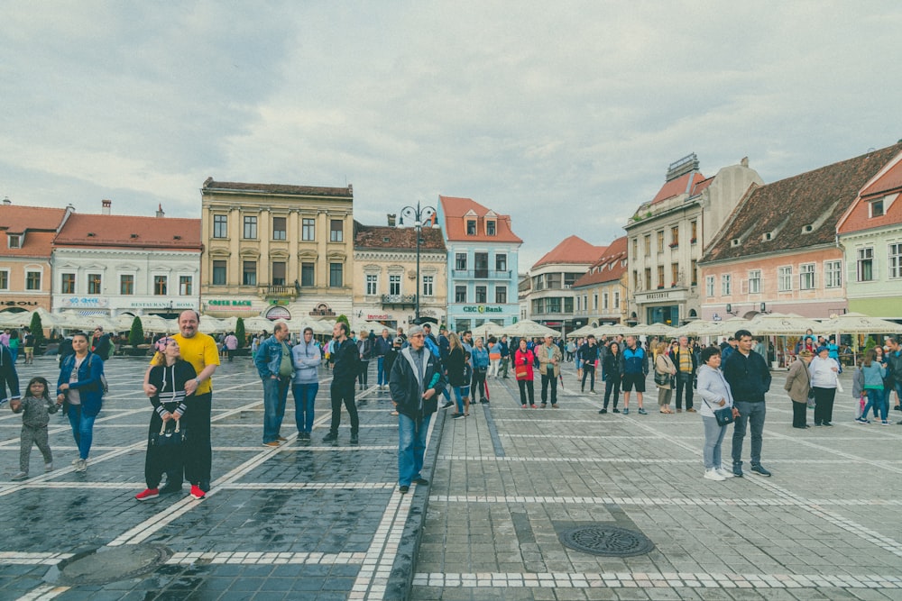 people walking at the town square during daytime