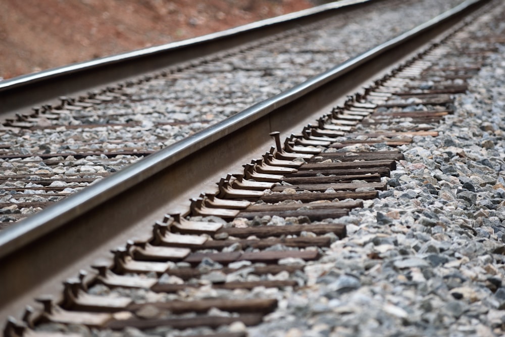 grey metal train track during daytime