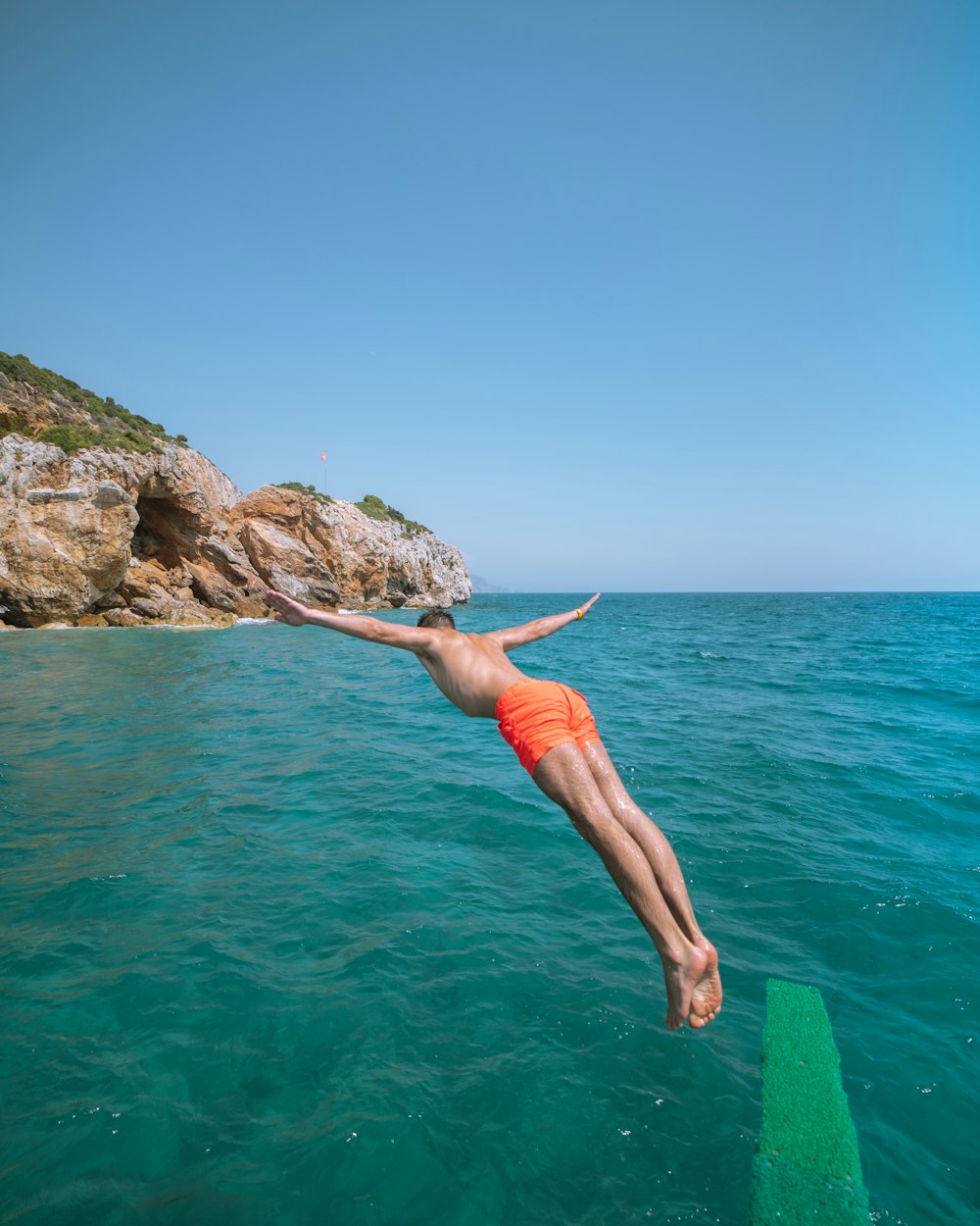 man diving on the ocean