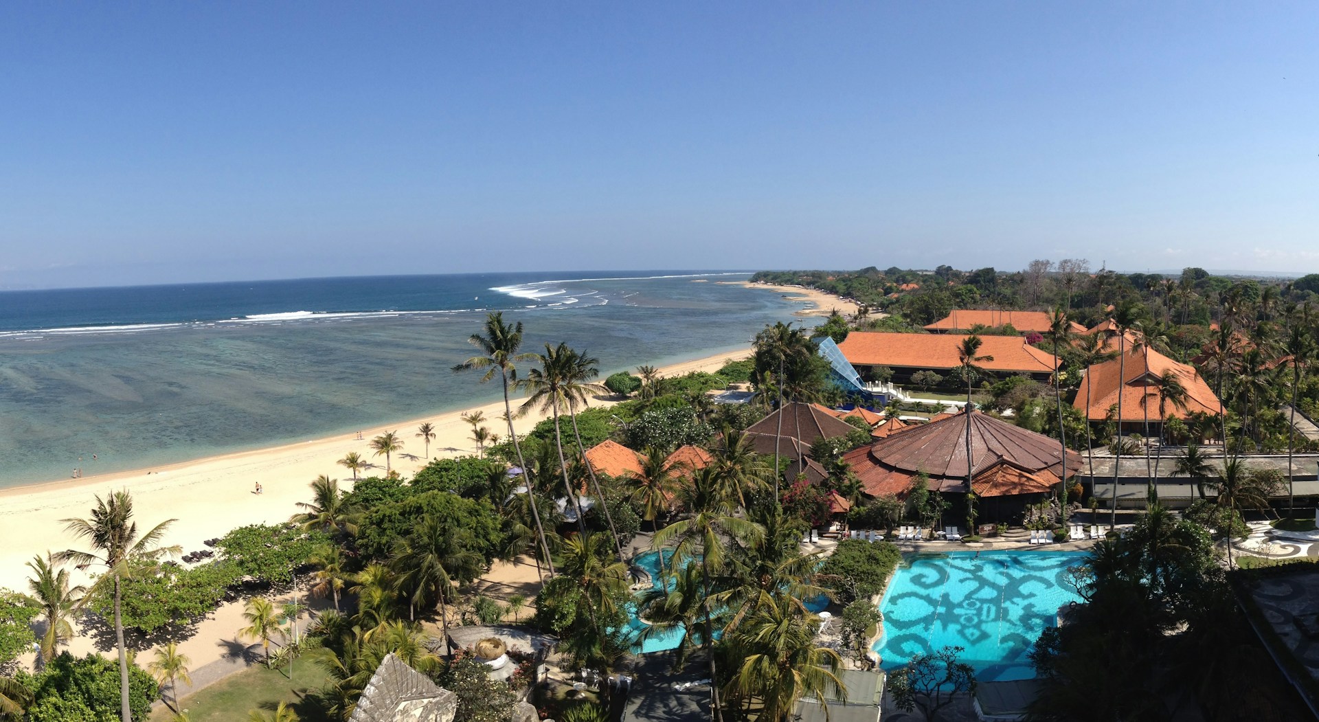 woman wearing yellow long-sleeved dress under white clouds and blue sky during daytime