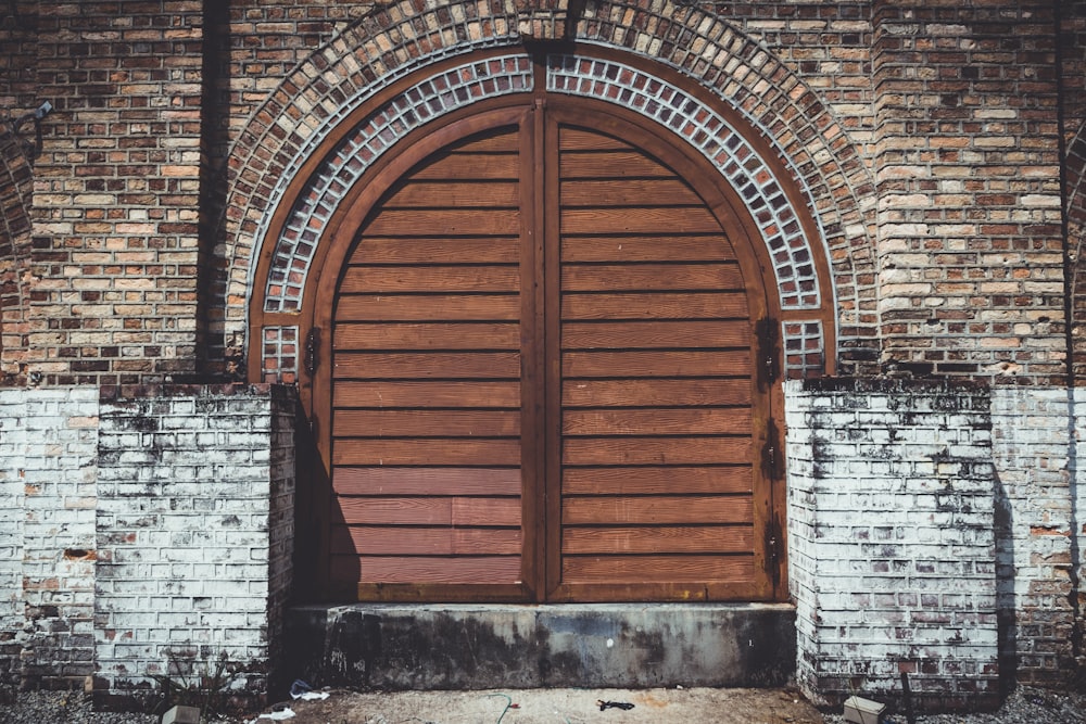 a brick building with a large wooden door