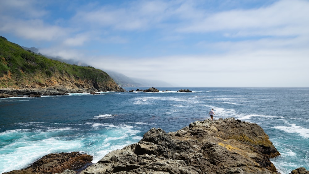 seashore with rock formation ]