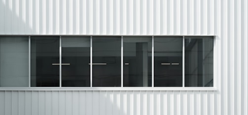 Commercial retrofit project featuring updated exterior facade with clean lines.