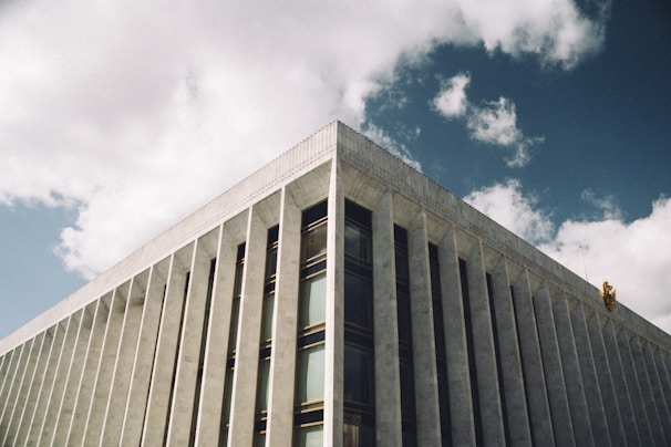 A panoramic view of an institutional building with visible structural elements and modern design.