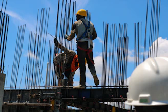 a man standing on top of a metal structure