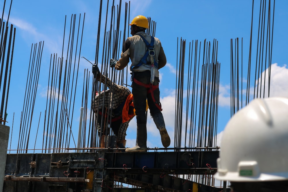 a man standing on top of a metal structure