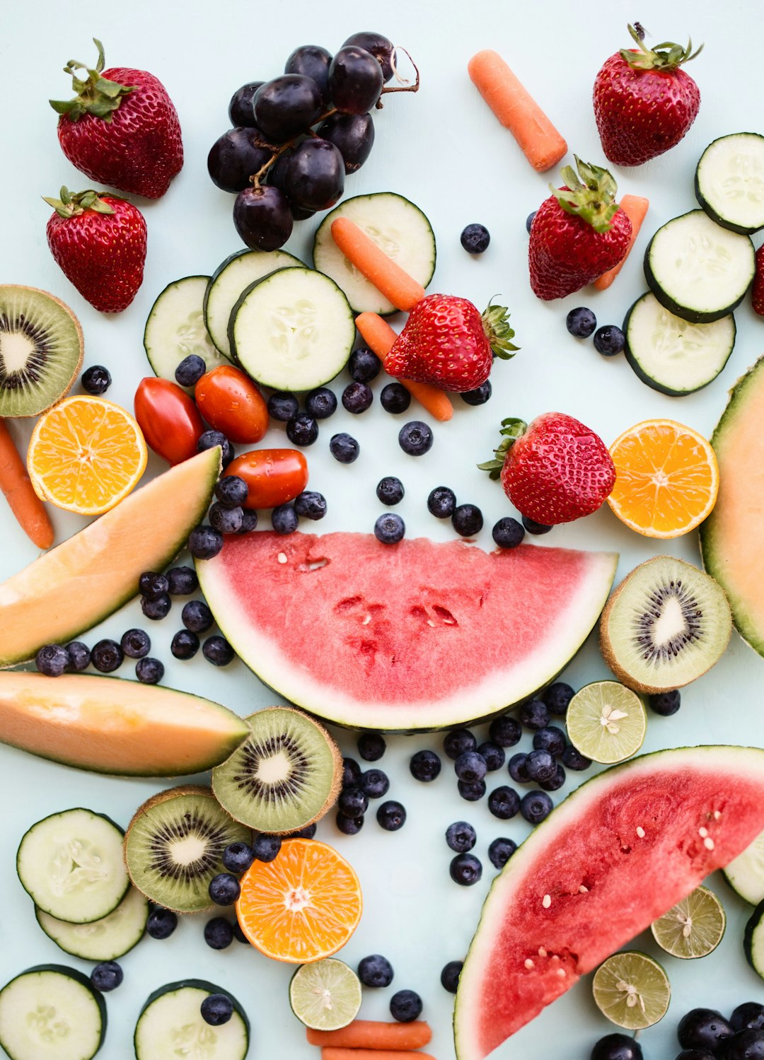 sliced fruits on white surface