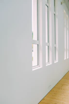 A bright office space with large windows and minimalist decor reflecting Nordic design principles.