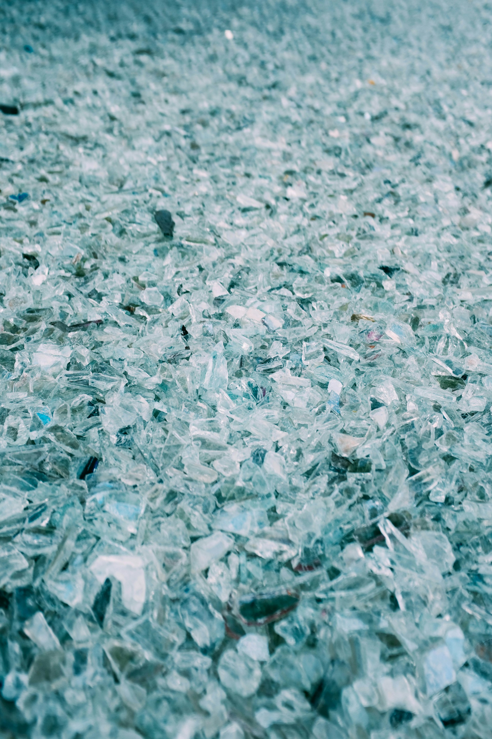 a lot of broken glass sitting on top of a floor