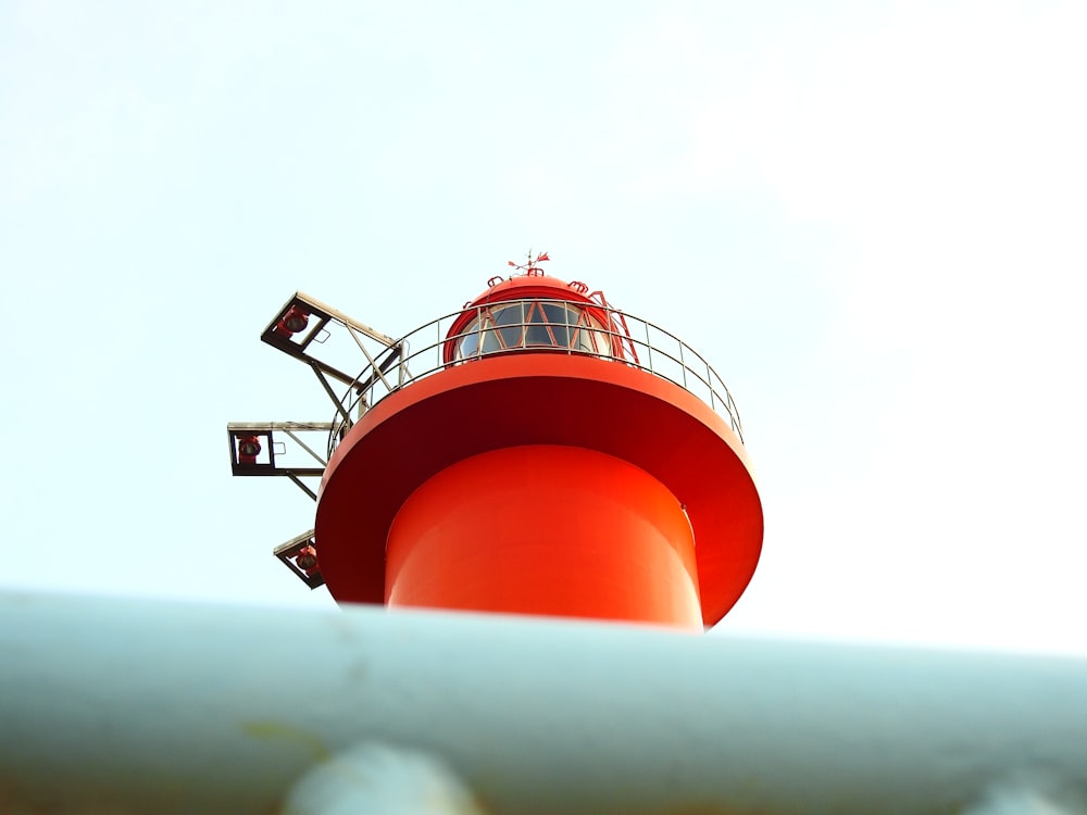 low angle photography of orange light tower