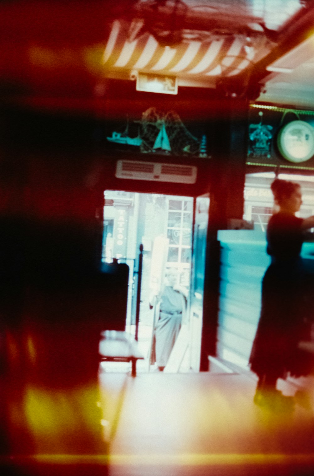 a blurry photo of a person standing in a doorway
