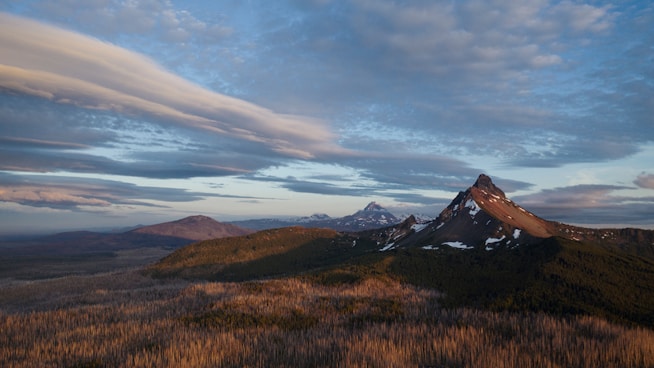 mountain range under clear blue sky