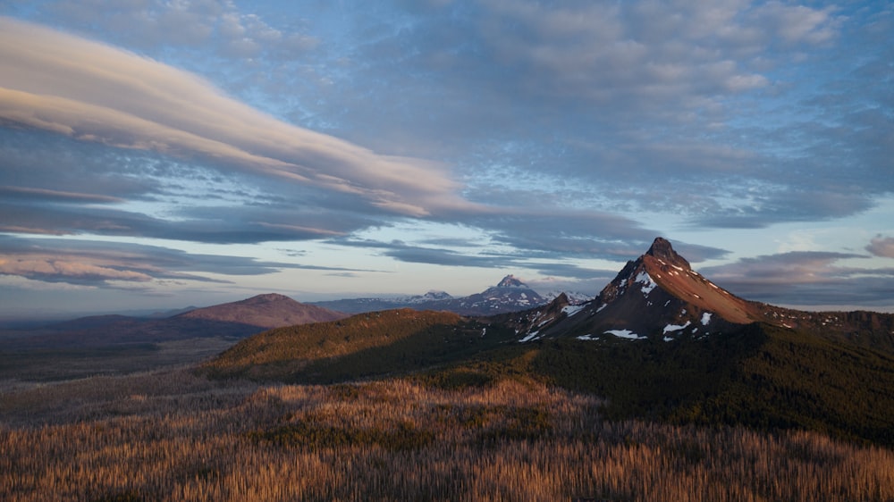 mountain range under clear blue sky